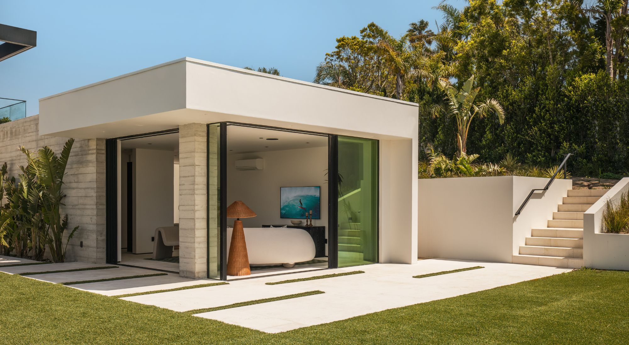 Fully concealed frame sliding door system with no visible aluminum in luxury coastal home