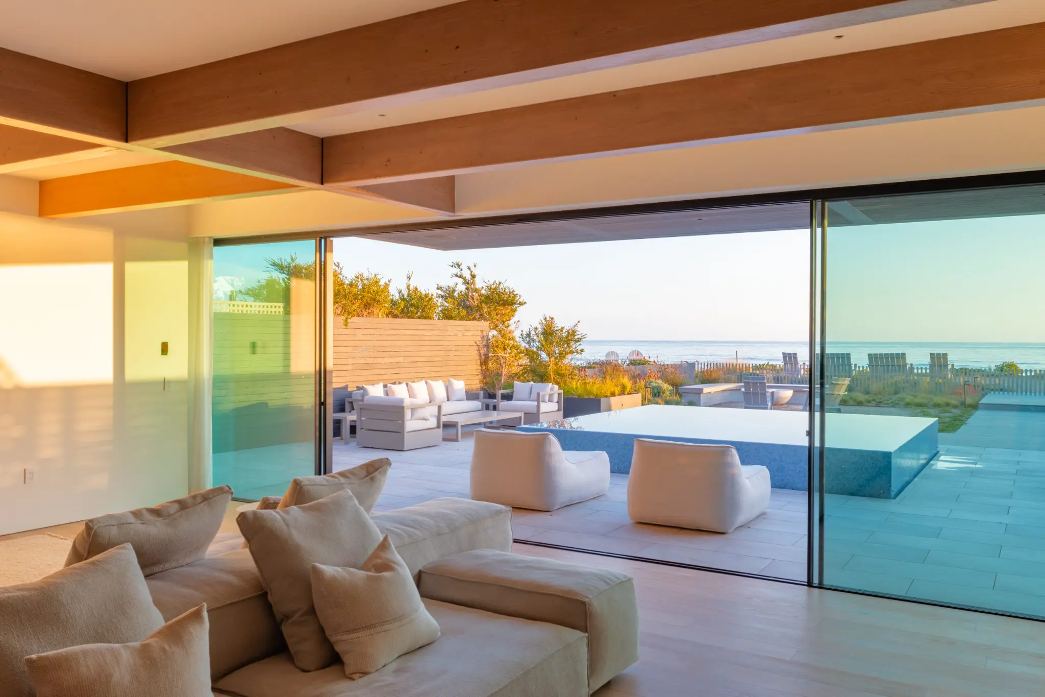 Hidden sill system with flush threshold transition between interior and exterior floor