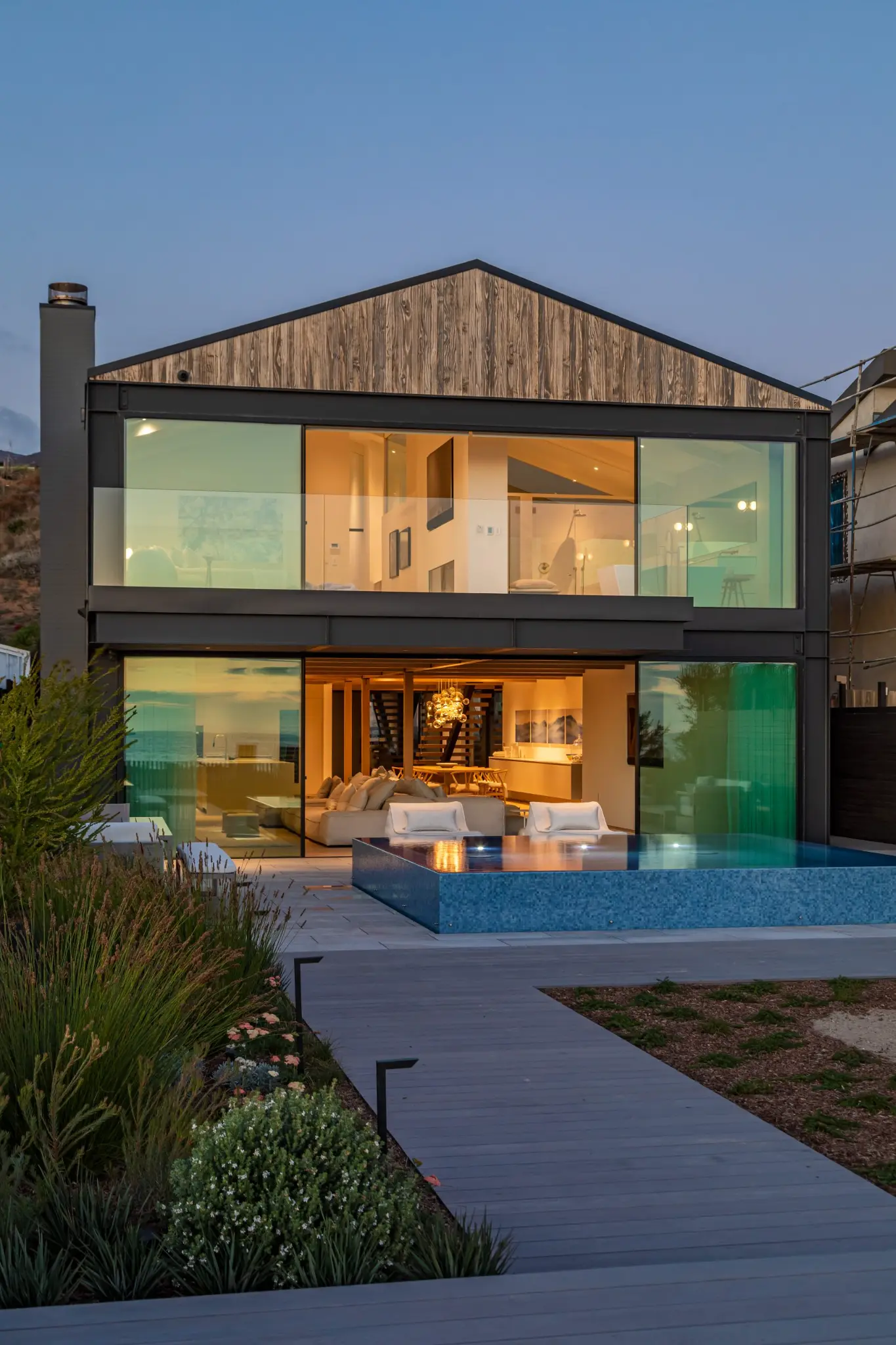 Minimal frame pocket sliding door disappearing into wall cavity in luxury residence