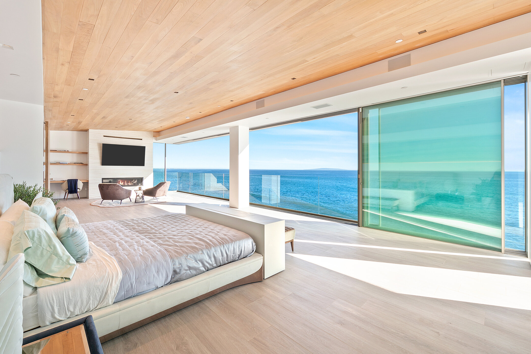 Ocean view bedroom with thermally broken minimal frame sliding glass wall
