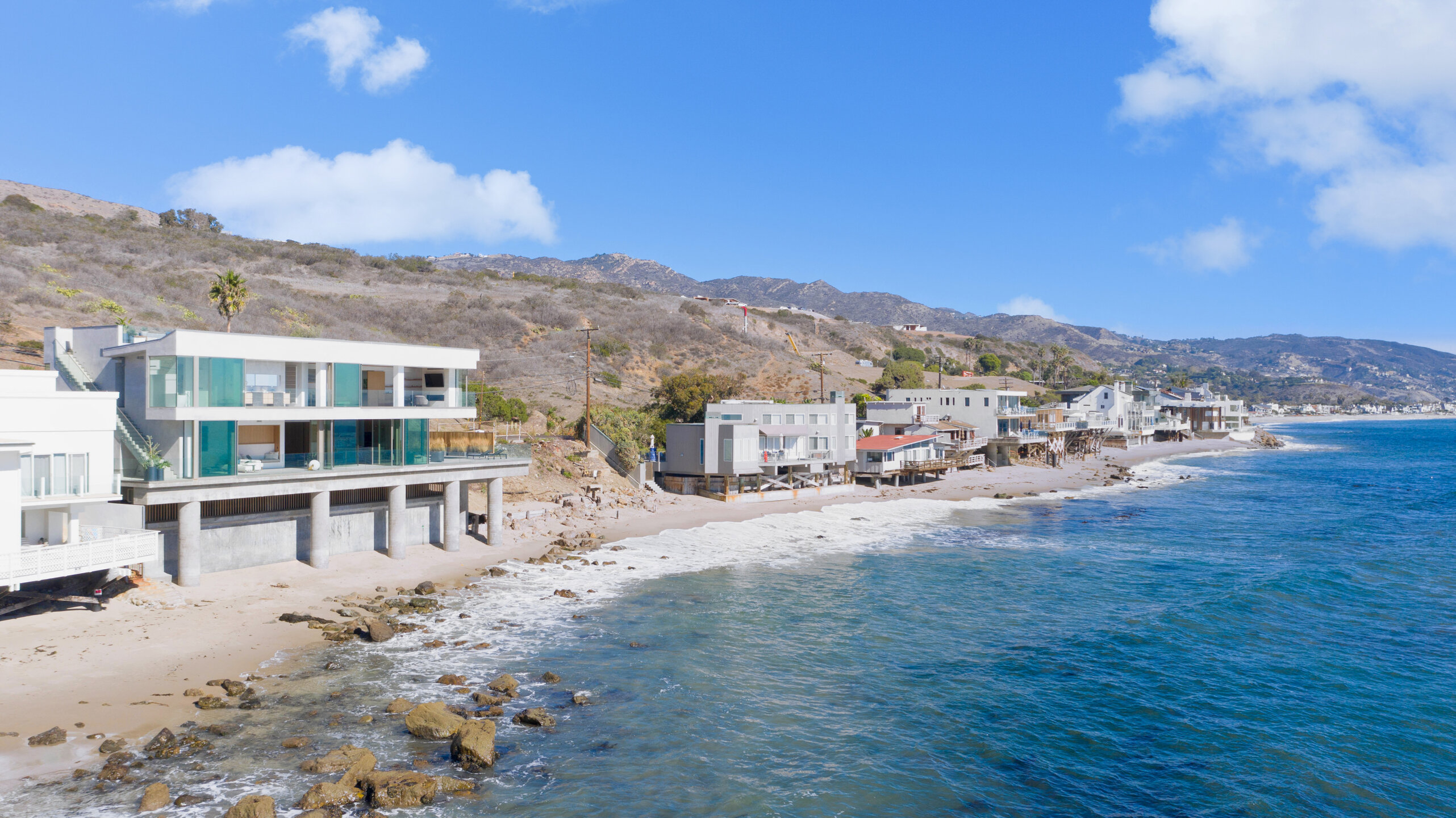 Modern hillside residence with Styline minimal frame sliding glass doors and ocean views